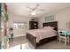 Comfortable bedroom featuring a plush bed, natural light, and stylish furniture creating a relaxing retreat at 1217 W Fever Tree Ave, San Tan Valley, AZ 85140