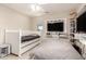 Well-lit bedroom with twin bed, storage, television, and modern decor for a serene living space at 1217 W Fever Tree Ave, San Tan Valley, AZ 85140