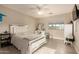 Bright bedroom with white furniture, closet, and well-lit interiors and space-saving storage at 1217 W Fever Tree Ave, San Tan Valley, AZ 85140