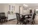 Dining area featuring a modern table with chairs, stylish decor, and plenty of room for entertaining at 1217 W Fever Tree Ave, San Tan Valley, AZ 85140