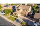 Two-story home with neutral siding, brown shutters, landscaped front yard, and a two car garage at 1217 W Fever Tree Ave, San Tan Valley, AZ 85140