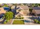 Two-story home with neutral siding, brown shutters, landscaped front yard, and a two car garage at 1217 W Fever Tree Ave, San Tan Valley, AZ 85140