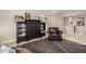 Upstairs loft with comfortable seating and bookcase; ideal for relaxation or study in this well-lit space at 1217 W Fever Tree Ave, San Tan Valley, AZ 85140