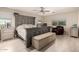 This spacious main bedroom features stylish decor and lots of natural light, creating a peaceful retreat at 1217 W Fever Tree Ave, San Tan Valley, AZ 85140