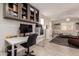 Well-lit office space with desk, cabinetry, 3D printer, and open storage solutions for maximum organization at 1217 W Fever Tree Ave, San Tan Valley, AZ 85140