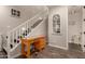 Stylish staircase with modern design elements, a charming window, and a convenient workspace area at 1217 W Fever Tree Ave, San Tan Valley, AZ 85140