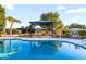 Beautiful backyard featuring a sparkling pool and an outdoor gazebo with seating at 12271 N 74Th St, Scottsdale, AZ 85260