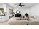 Bright living room with modern fireplace, neutral colors, and views of the outdoor pool at 12271 N 74Th St, Scottsdale, AZ 85260