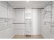 Bright, white walk-in closet with ample shelving and storage at 12271 N 74Th St, Scottsdale, AZ 85260