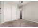 Neutral bedroom with carpet, ceiling fan, and closet with sliding doors at 1228 W Snowbell Ave, Queen Creek, AZ 85140