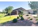 Desirable single-story home featuring desert landscaping, mature trees and privacy wall at 1228 W Snowbell Ave, Queen Creek, AZ 85140