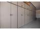 Extensive garage storage system with sleek, modern cabinets for organized storage space at 1228 W Snowbell Ave, Queen Creek, AZ 85140