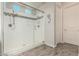 Bathroom with a large glass shower featuring tile and a built-in seat at 1228 W Snowbell Ave, Queen Creek, AZ 85140