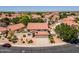 Aerial view of a home with a tile roof in a residential neighborhood, with mature landscaping at 12748 N 57Th Dr, Glendale, AZ 85304