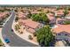 Desirable neighborhood with a well-maintained home featuring an attached garage, mature landscaping, and a red-tile roof at 12748 N 57Th Dr, Glendale, AZ 85304