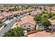 A residential backyard featuring a sparkling pool, mature landscaping, and a private, fenced yard under a bright, sunny sky at 12748 N 57Th Dr, Glendale, AZ 85304