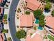 Aerial view of homes in community with pools, manicured lawns, and terracotta roofs at 12748 N 57Th Dr, Glendale, AZ 85304