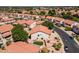 Charming single-Gathering home with a red-tile roof, lush trees, manicured yard, and a private, fenced backyard at 12748 N 57Th Dr, Glendale, AZ 85304