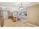 Open-concept kitchen leading to living room with ample counter space and seating at 12748 N 57Th Dr, Glendale, AZ 85304