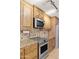 Modern kitchen featuring stainless steel appliances and custom cabinetry at 12748 N 57Th Dr, Glendale, AZ 85304