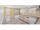 Bright living room with tiled floors, large windows, and modern lighting fixtures at 12748 N 57Th Dr, Glendale, AZ 85304