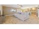 Spacious living room featuring comfortable seating, tile floors, and natural light at 12748 N 57Th Dr, Glendale, AZ 85304