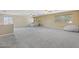 This spacious loft is bright, with neutral walls, plush carpet, and ample natural light at 12748 N 57Th Dr, Glendale, AZ 85304