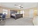 Spacious main bedroom with a ceiling fan and ensuite bathroom at 12748 N 57Th Dr, Glendale, AZ 85304