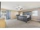 Relaxing main bedroom with large bed, ceiling fan, and sliding door to outdoor space at 12748 N 57Th Dr, Glendale, AZ 85304