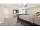 Main bedroom with a ceiling fan, tv, and walk-out to a patio at 12748 N 57Th Dr, Glendale, AZ 85304