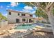 Relaxing backyard oasis with pool, spa, covered patio, and mature trees at 12748 N 57Th Dr, Glendale, AZ 85304