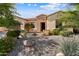 Beautiful house featuring desert landscaping, brick accents, and a welcoming front patio at 12904 W Dale Ln, Peoria, AZ 85383