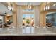 Spacious kitchen with granite counters open to the living and dining areas at 12904 W Dale Ln, Peoria, AZ 85383