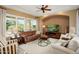 Cozy living room with large windows, comfortable seating, and a relaxing atmosphere at 12904 W Dale Ln, Peoria, AZ 85383