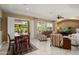 Open-concept living and dining area with great natural light and patio access at 12904 W Dale Ln, Peoria, AZ 85383