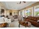 Bright living room featuring a dining area, comfortable seating, and sliding glass doors at 12904 W Dale Ln, Peoria, AZ 85383