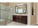 Elegant bathroom with a large walk-in shower, spacious vanity, and ample lighting at 12904 W Dale Ln, Peoria, AZ 85383
