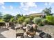 Inviting patio with comfortable seating and lush landscaping, perfect for outdoor relaxation and entertaining at 12904 W Dale Ln, Peoria, AZ 85383