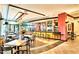 Restaurant and bar area with abundant seating, modern lighting, and stylish decor at 12904 W Dale Ln, Peoria, AZ 85383