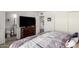 Bedroom showcasing a large TV, dresser, and an ensuite bathroom at 1401 E Puget Ave # 4, Phoenix, AZ 85020