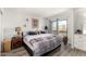 Spacious bedroom with a king-size bed, balcony access, and scenic views at 1401 E Puget Ave # 4, Phoenix, AZ 85020