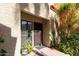 Charming condo exterior with a decorative metal security door and a lush potted plant at 1401 E Puget Ave # 4, Phoenix, AZ 85020