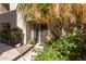 Charming front entrance surrounded by lush greenery and vibrant flowers at 1401 E Puget Ave # 4, Phoenix, AZ 85020