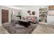 Cozy living room with a fireplace, stylish decor, and a large area rug over hardwood flooring at 1401 E Puget Ave # 4, Phoenix, AZ 85020