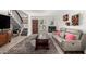 Inviting living area with hardwood floors, fireplace, comfortable seating, and staircase to the upper level at 1401 E Puget Ave # 4, Phoenix, AZ 85020