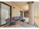 Relax and enjoy the outdoors on this unit's comfortable balcony with furniture at 14910 N Kings Way # 206, Fountain Hills, AZ 85268