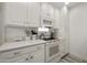 Bright kitchen featuring white cabinets, quartz countertops, and stainless steel appliances at 14910 N Kings Way # 206, Fountain Hills, AZ 85268