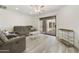 Comfortable living room featuring a private balcony, neutral decor, and ceiling fan at 14910 N Kings Way # 206, Fountain Hills, AZ 85268