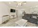Open-concept living area with a neutral color scheme, including view to dining area and kitchen at 14910 N Kings Way # 206, Fountain Hills, AZ 85268