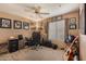Bedroom with home office, guitar, ceiling fan, and wall art and decorations at 15256 N 62Nd Ave, Glendale, AZ 85306
